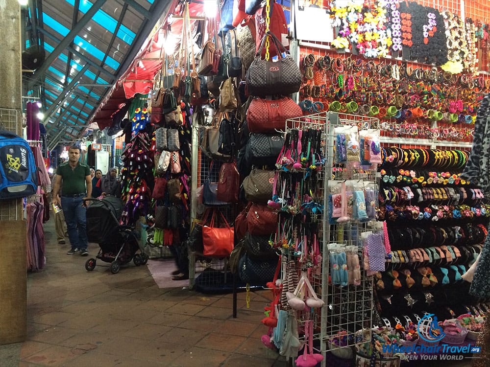 PHOTO DESCRIPTION: A series of street vendor stalls in the Little India district of Kuala Lumpur.