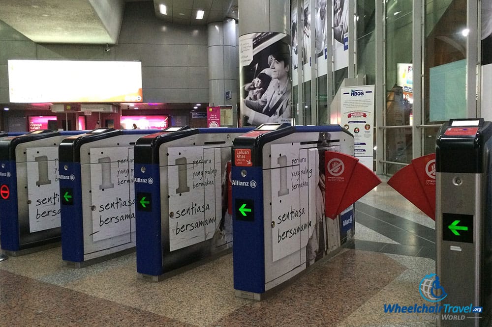 PHOTO DESCRIPTION: Wheelchair accessible fare collection gate at the KL Sentral LRT station in Kuala Lumpur, Malaysia.