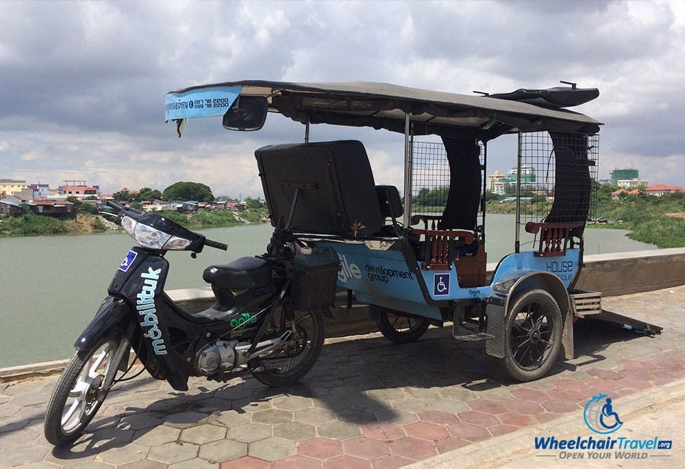 PHOTO DESCRIPTION: Mobilituk parked, with the Mekong River in the background.