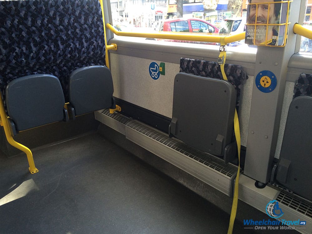 PHOTO DESCRIPTION: Reserved space for wheelchairs on a city bus in Berlin, Germany.