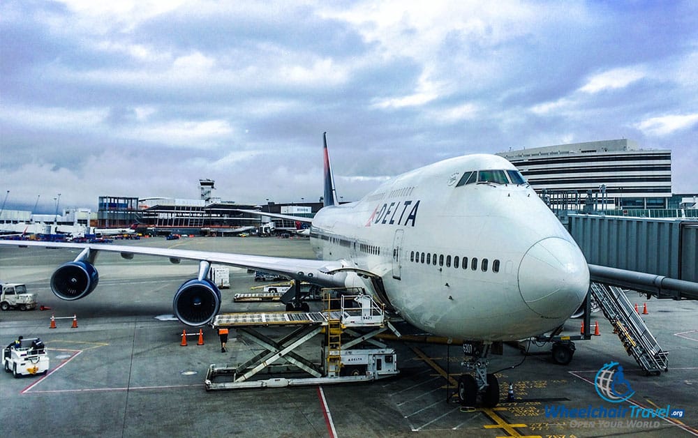 PHOTO DESCRIPTION: Delta Boeing 747 airplane at Seattle airport gate.