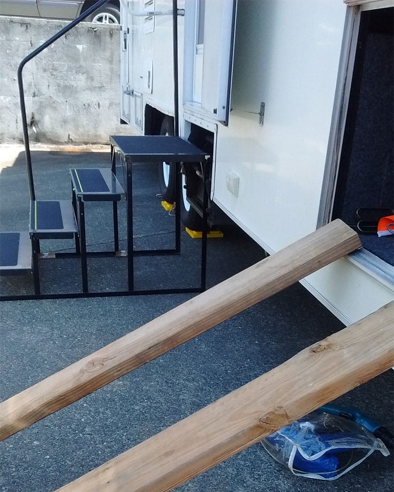 PHOTO DESCRIPTION: Makeshift ramp created with two boards.