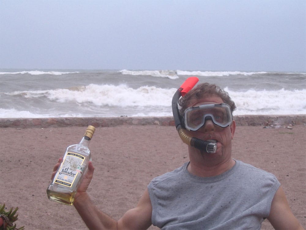 PHOTO DESCRIPTION: Rick outside on the beach during Hurricane Jimena.