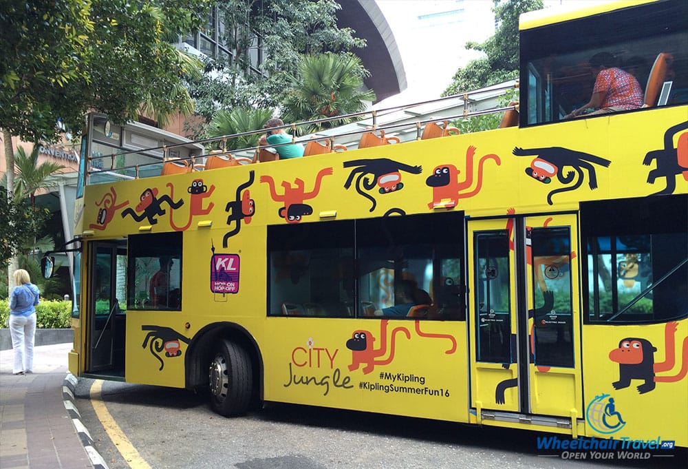 PHOTO DESCRIPTION: The double-decker KL Hop-on and Hop-off bus at the KLCC Aquarium stop.