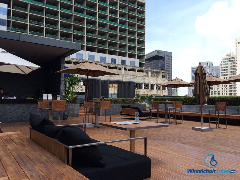 PHOTO DESCRIPTION: Rooftop bar on a patio by the pool.