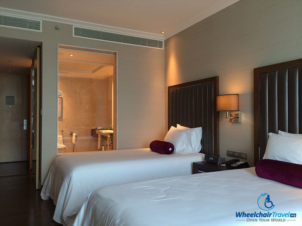 PHOTO DESCRIPTION: Two twin beds at the Radisson Blu Plaza Bangkok Hotel.