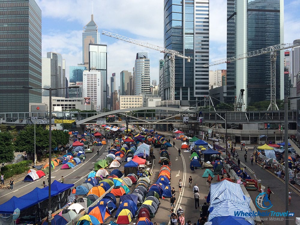 PHOTO DESCRIPTION: Umbrella Movement tent city set-up on a street in the Admiralty district of Hong Kong.