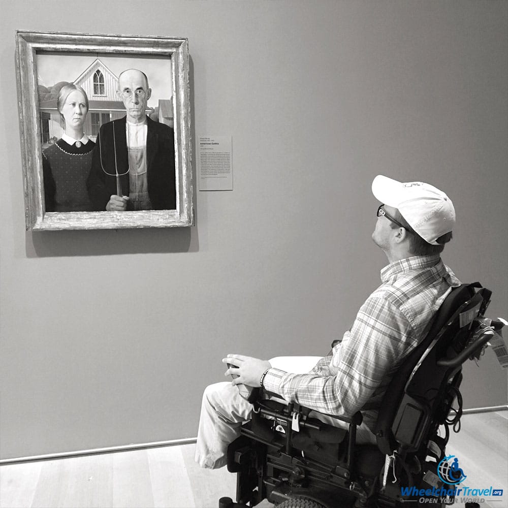 PHOTO: Wheelchair user John viewing Grant Wood's painting 'American Gothic' at the Art Institute of Chicago.