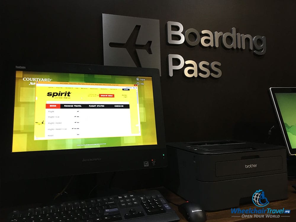 PHOTO: Printing Spirit Airlines boarding pass at hotel computer.