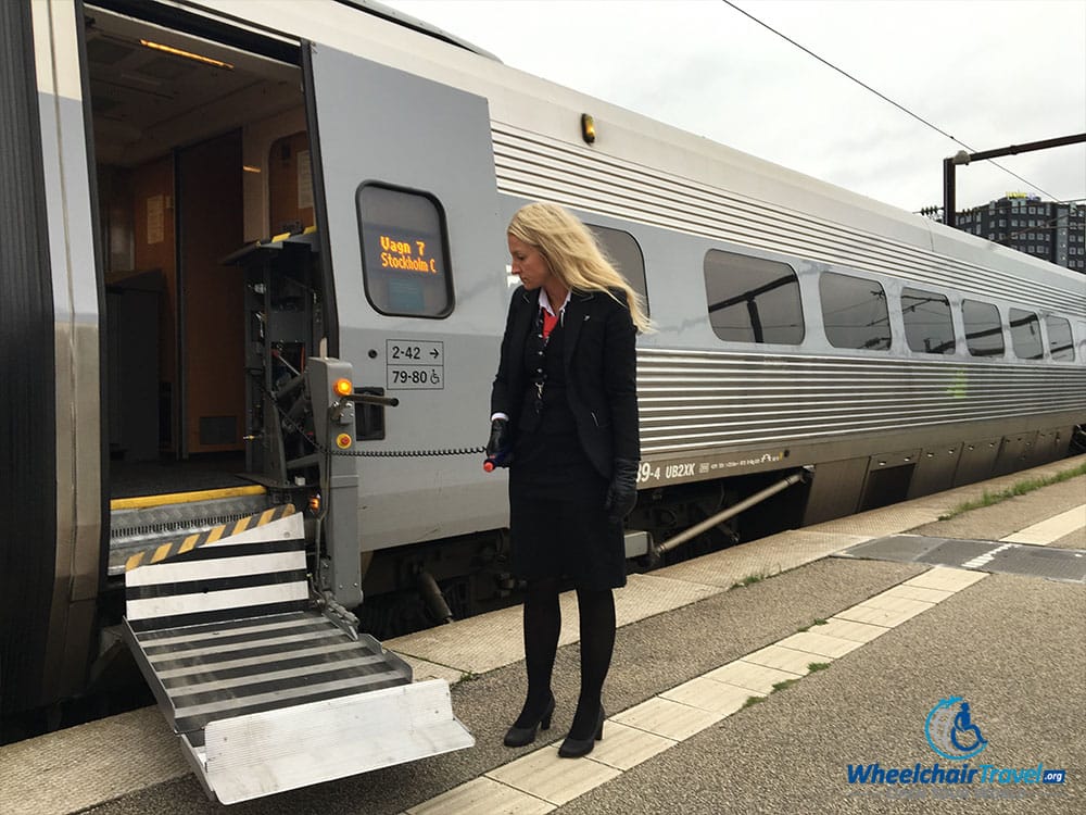 Built-in wheelchair lift on the SJ high speed train, operated by female conductor.