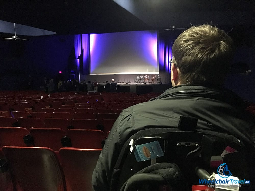 John Morris sitting inside the Texas Theatre.