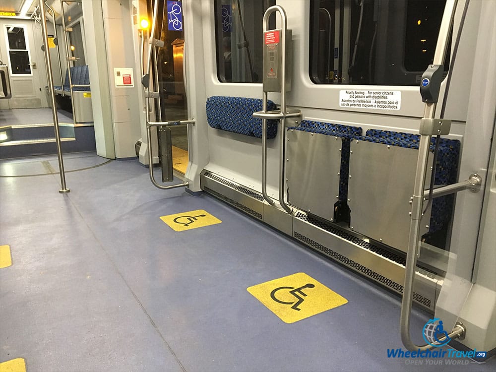 Wheelchair space with grabs bars.