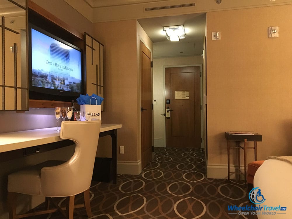 TV, desk, in-room hallway at Omni Dallas Hotel