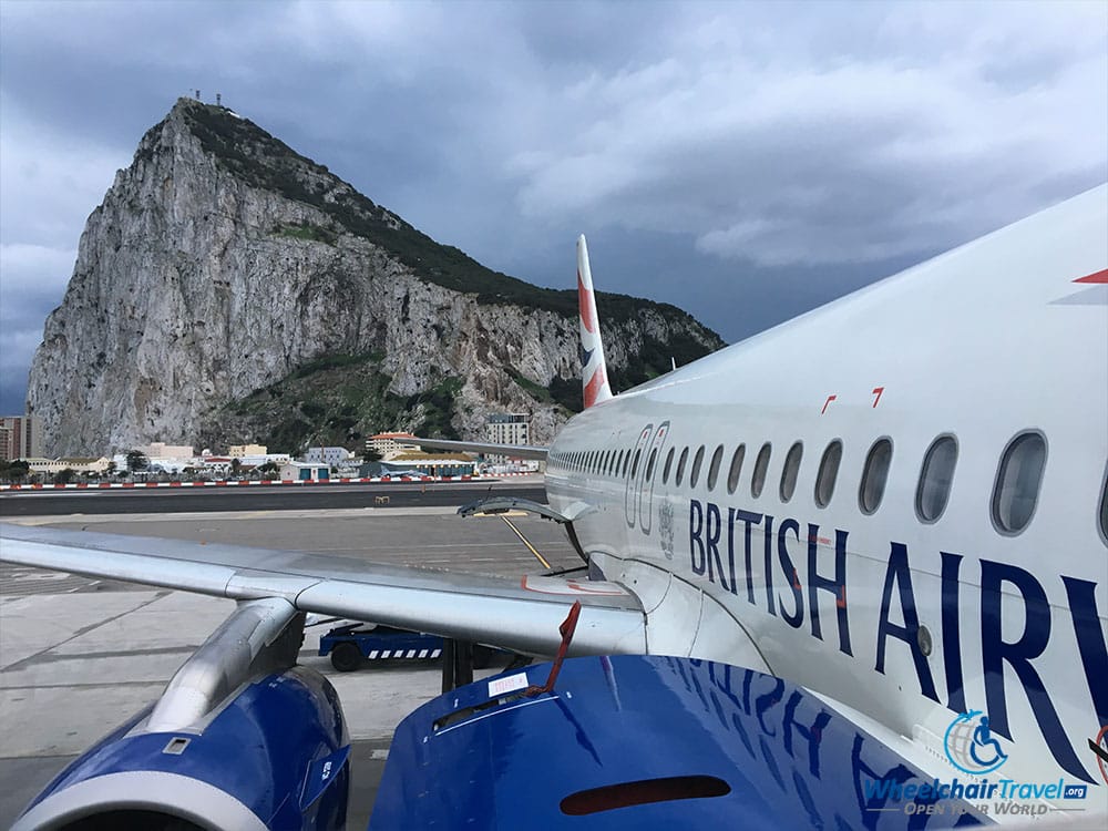 The Rock of Gibraltar, behind a British Airways A320 airplane