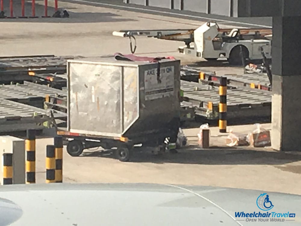 Banned electronic devices being loaded into a cargo container at Hamad International Airport