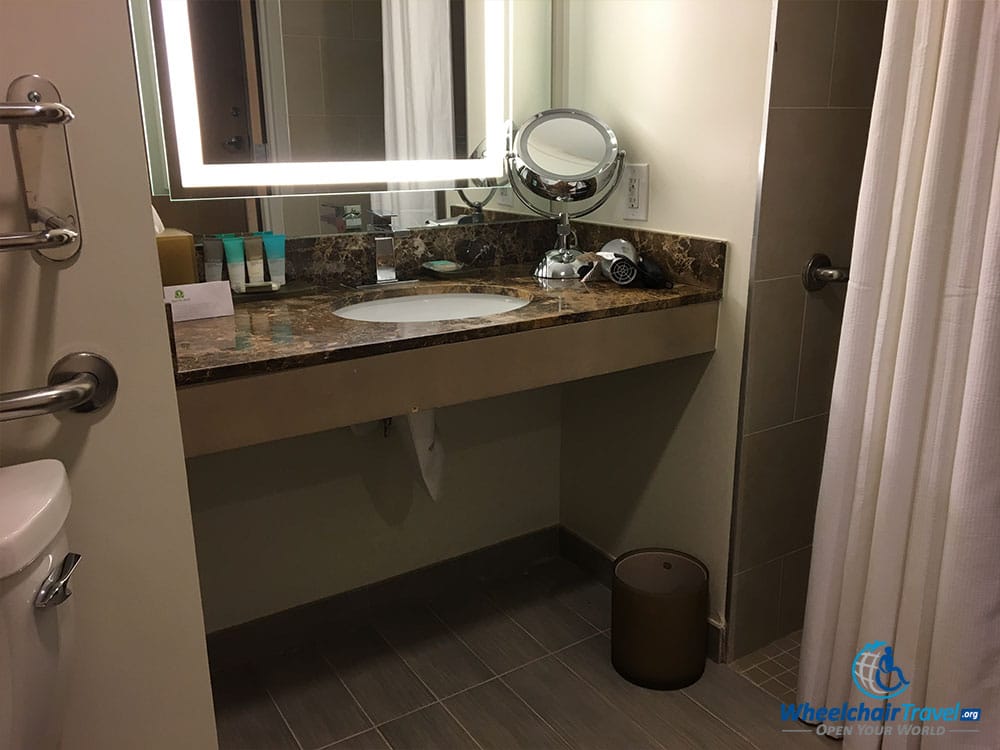 Bathroom sink with space to roll underneath in a wheelchair