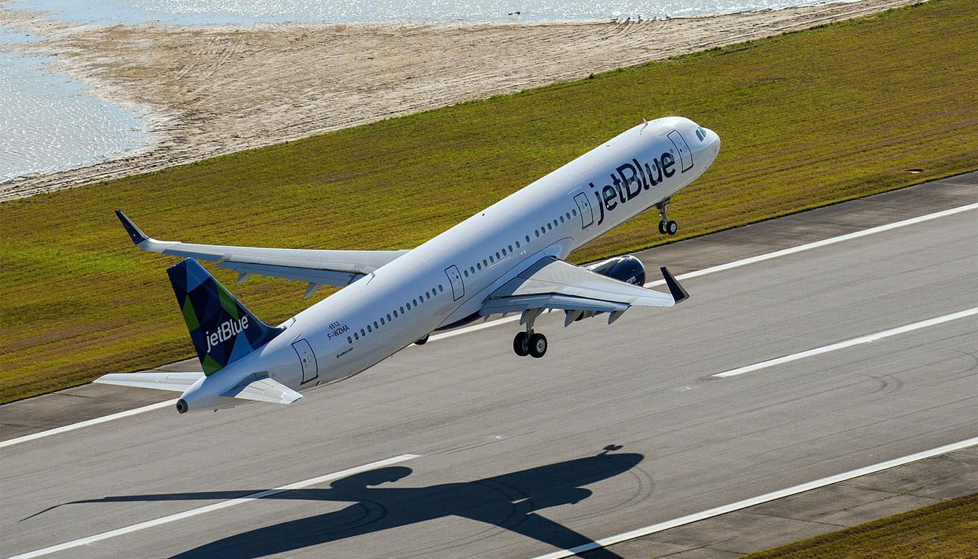 JetBlue Airways airplane taking off from an airport runway