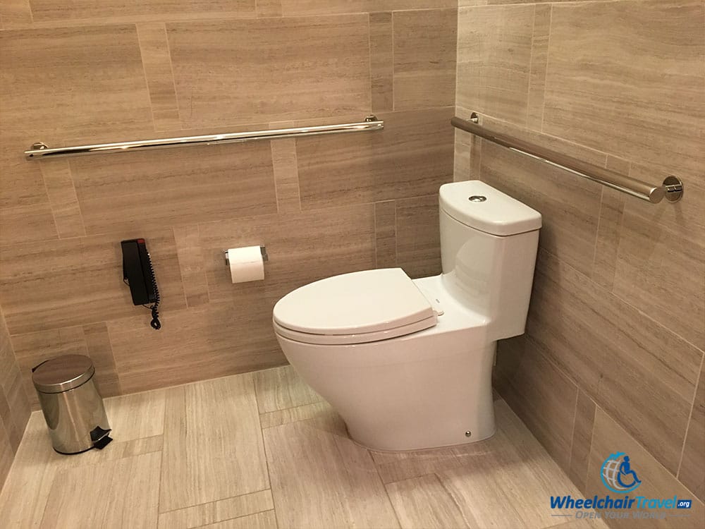 Wheelchair accessible toilet with grab bars