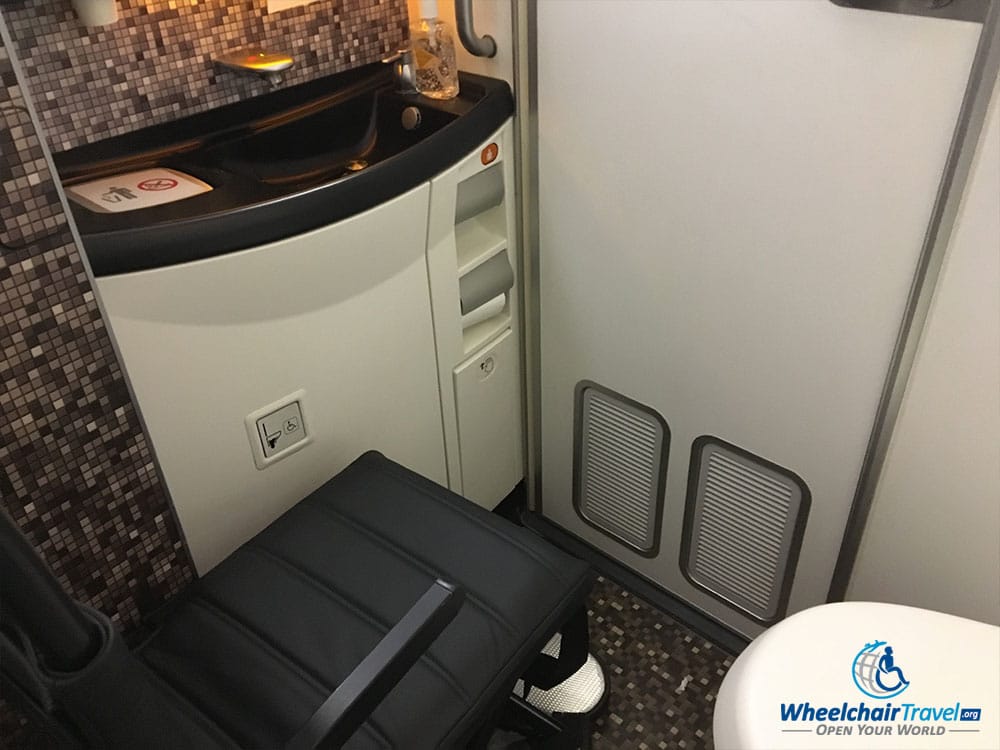 Aisle chair inside the accessible lavatory on an Etihad Airways Boeing 787.