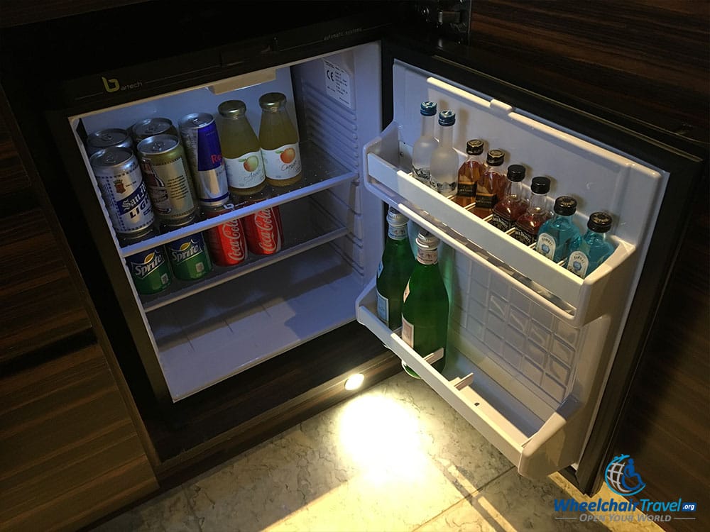 Minibar fridge with alcoholic and non-alcoholic beverages.