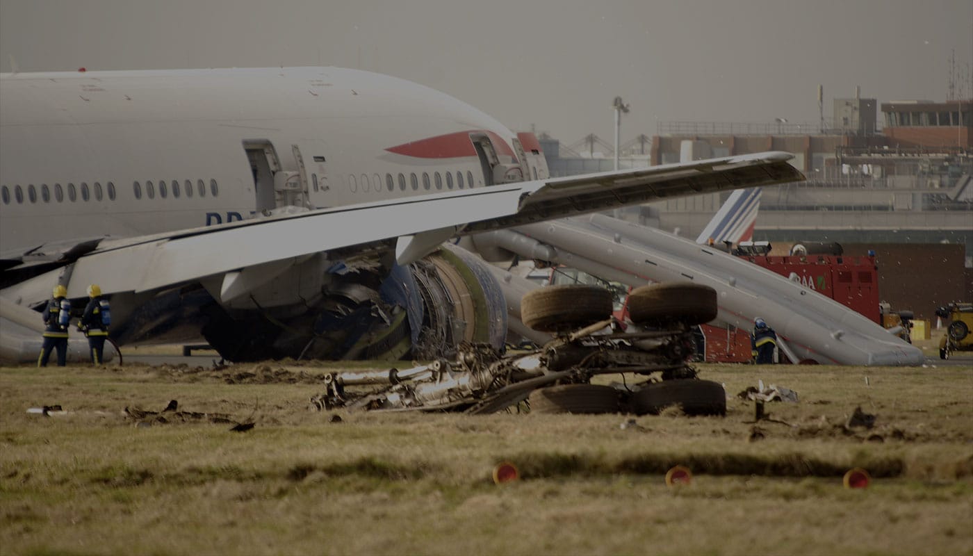 Crashed airplane with emergency evacuation slides deployed.