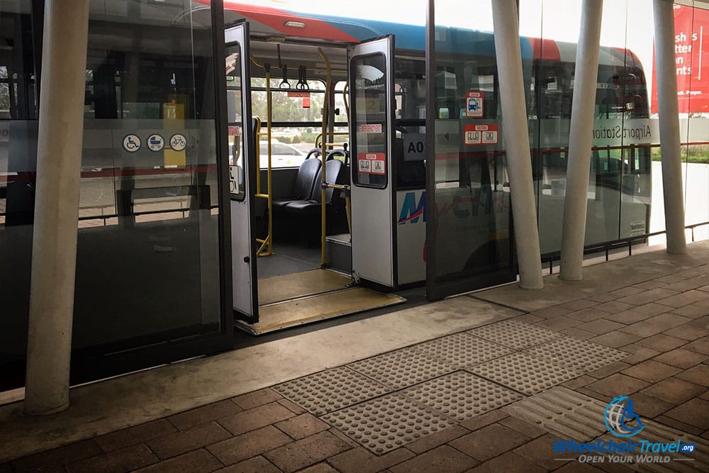 MyCiti bus at station with ramp extended.