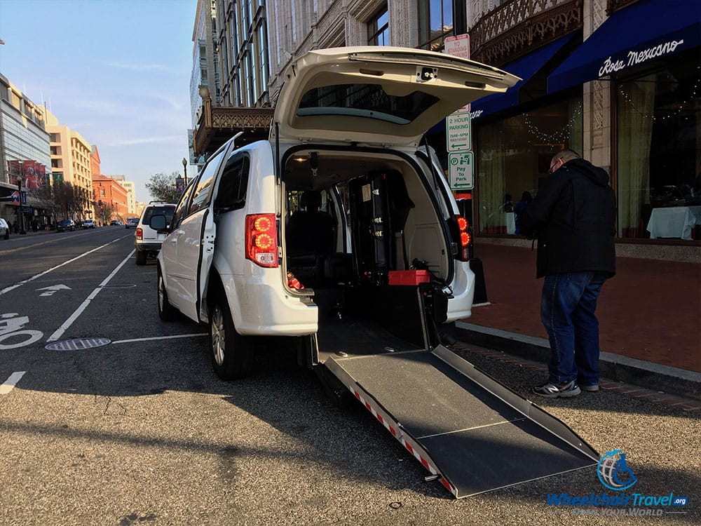 UberWAV Dodge Grand Caravan with rear-entry wheelchair ramp extended.