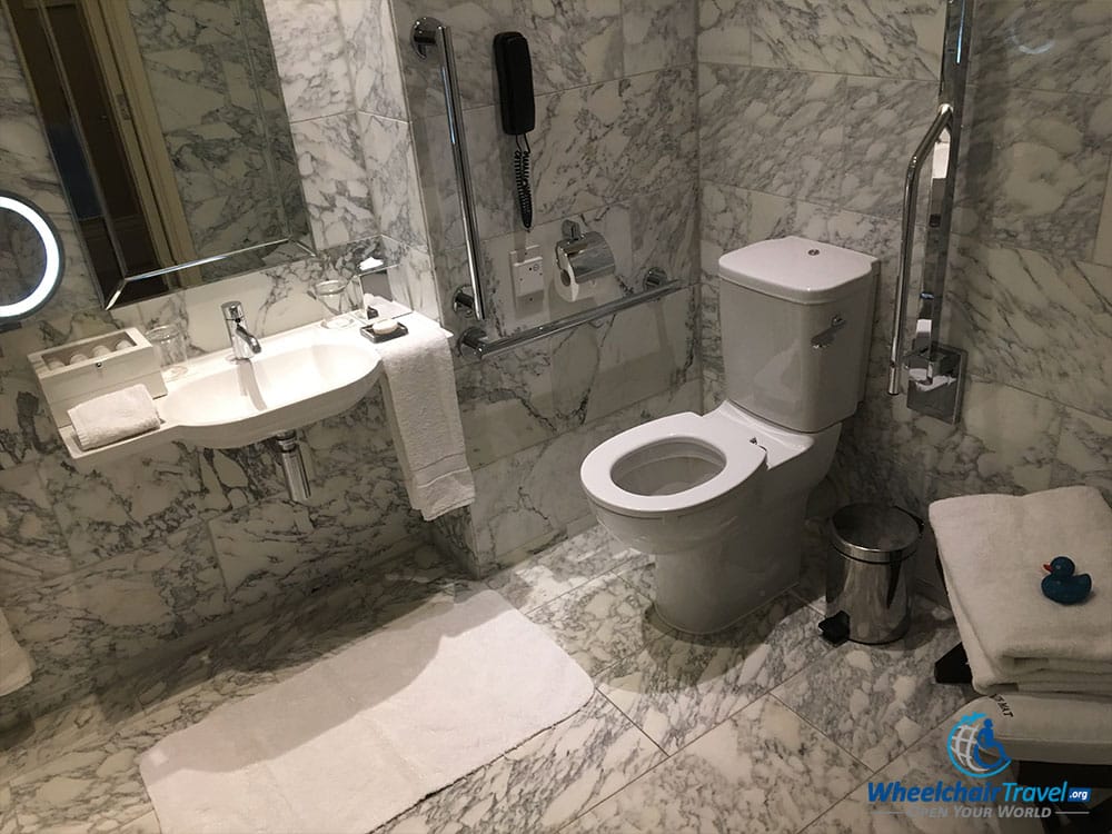 Accessible bathroom sink and toilet at St. Pancras Renaissance Hotel in London.