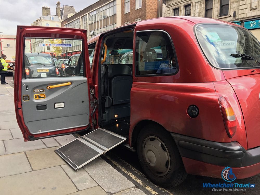 A London cab with the wheelchair ramp extended.