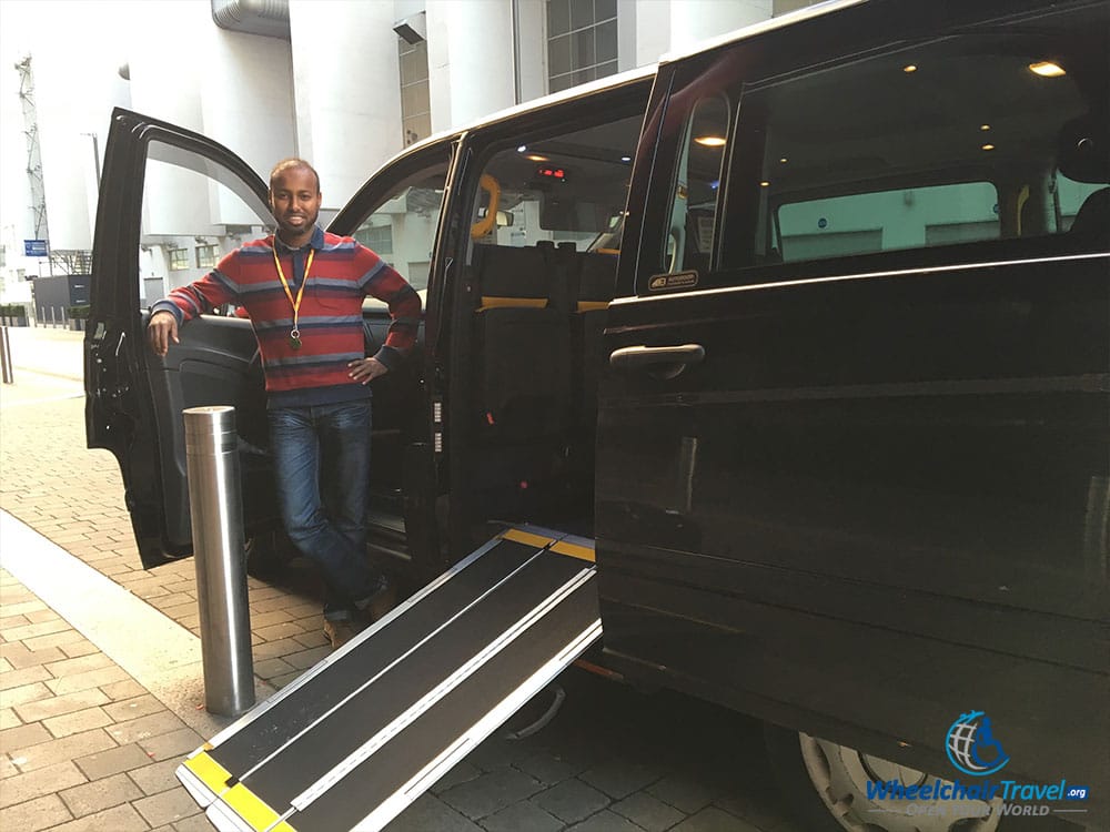 Full-size taxi van with wheelchair ramp in London.