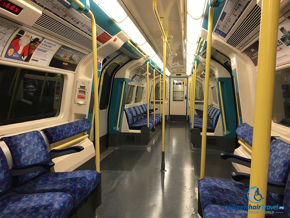 Interior of a wheelchair accessible London Underground train car.