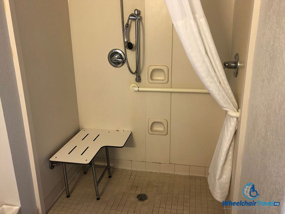 ADA-compliant roll-in shower at Travelodge.