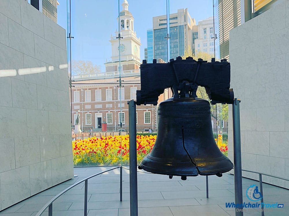 The Liberty Bell, with Independence Hall in the background.