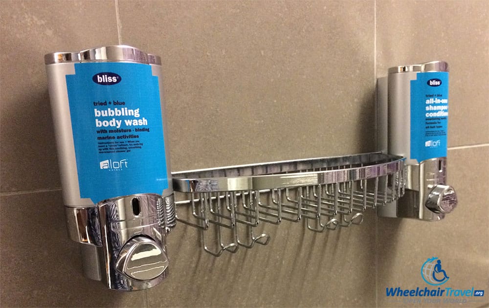 Wall-mounted body wash and shampoo/condition dispensers at an Aloft hotel.