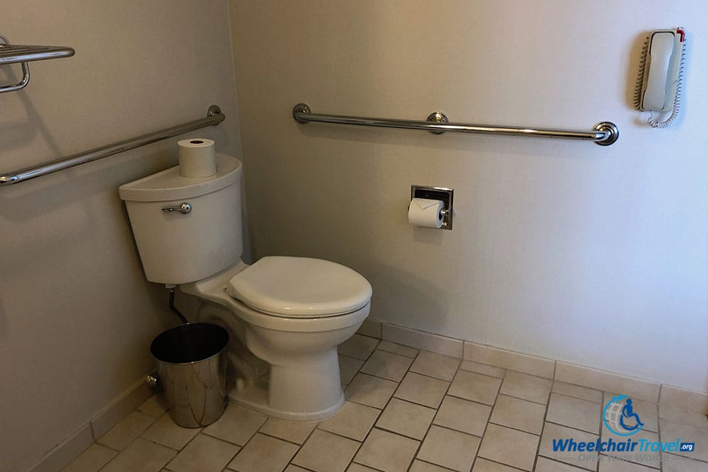 Toilet with grab bars.