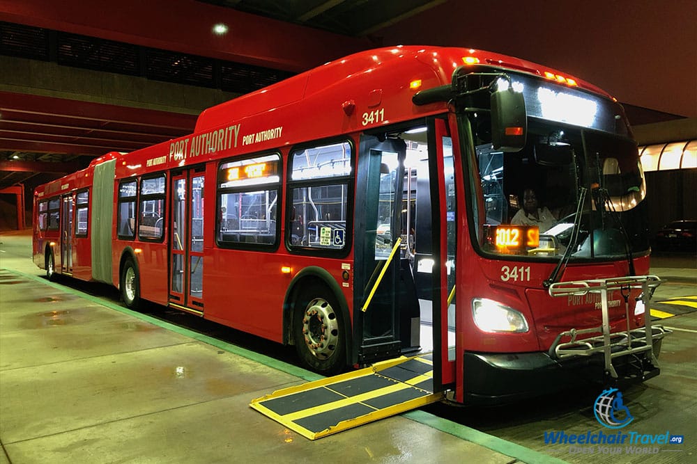 Pittsburgh city bus with wheelchair accessible boarding ramp extended.