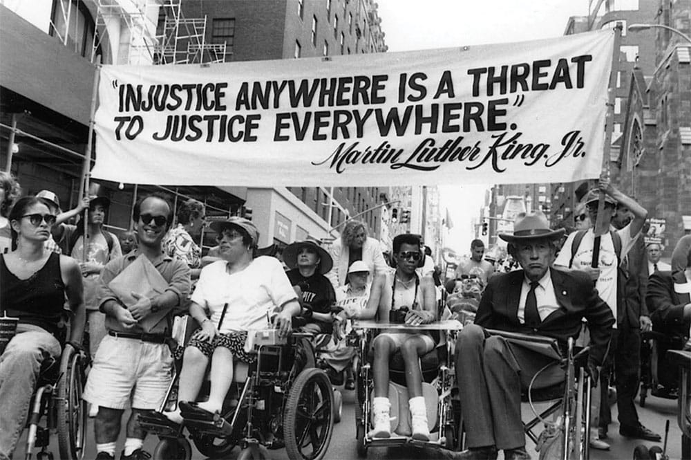 Disability activists march to secure passage of the ADA in 1990. | Photo by Tim Olin.