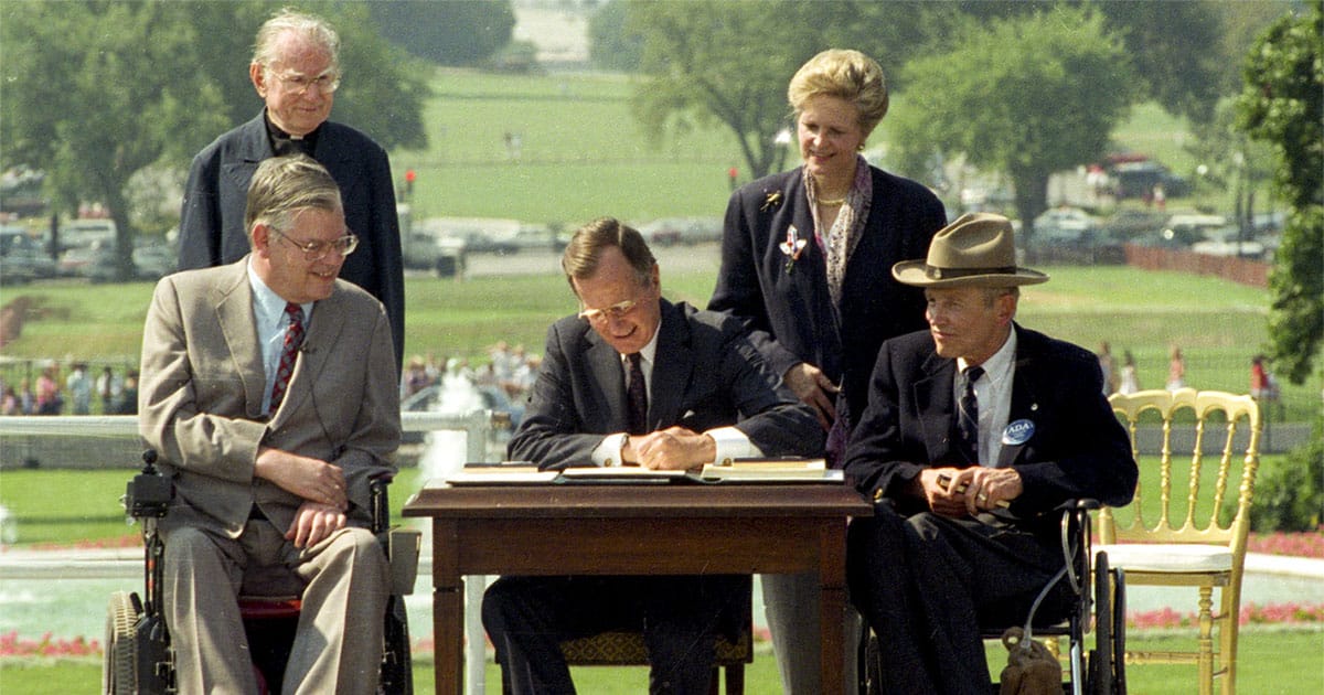 President George H.W. Bush signs the Americans with Disabilities Act into law.