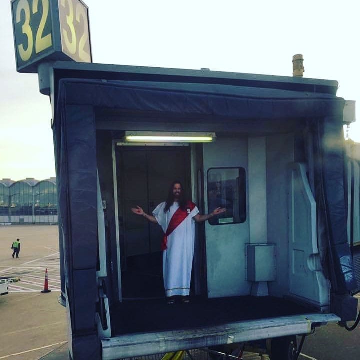 Jetway Jesus standing in an airport jet bridge.