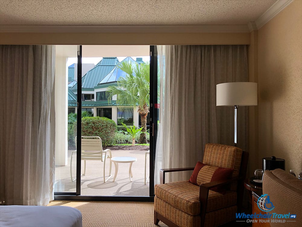 Large accessible hotel room with an outdoor patio.