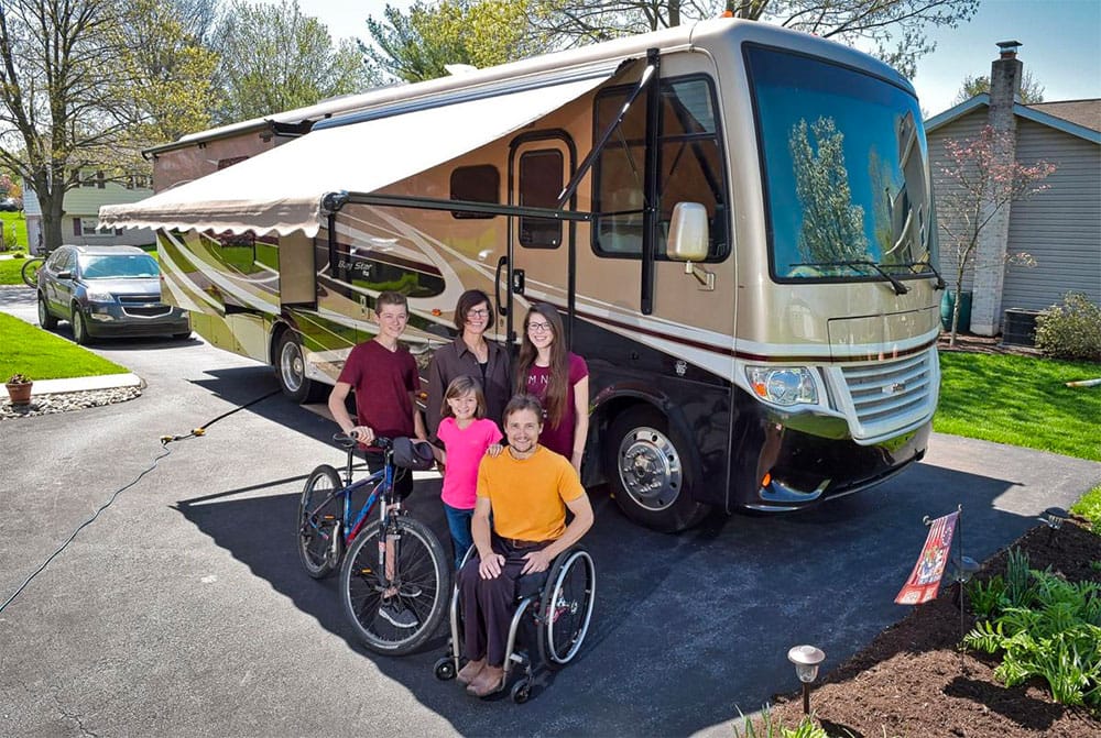 The Peachey family with their RV.