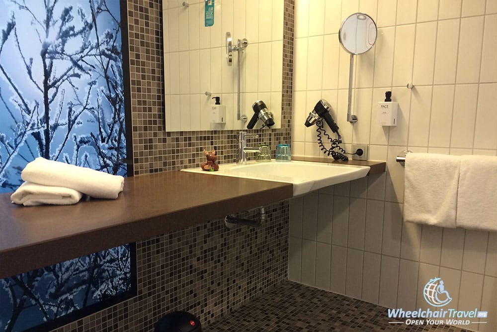 Wheelchair accessible bathroom sink at Scandic Berlin Potsdamer Platz hotel.