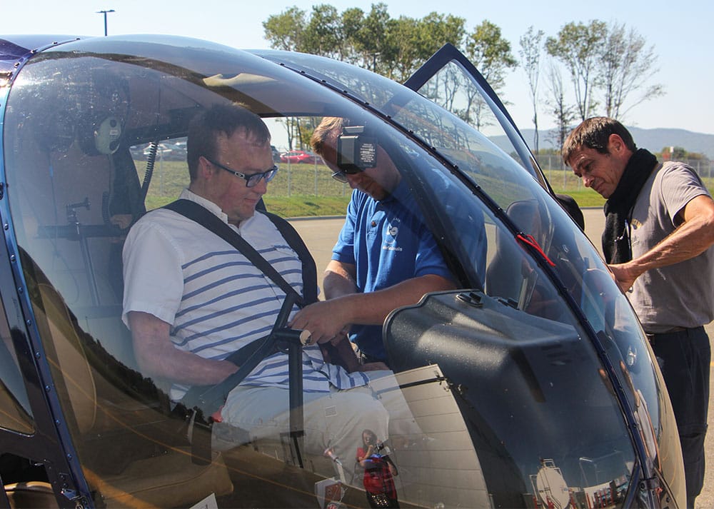 Buckling up for a safe helicopter ride.