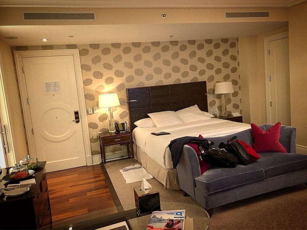 Spacious hotel room with a king size bed.