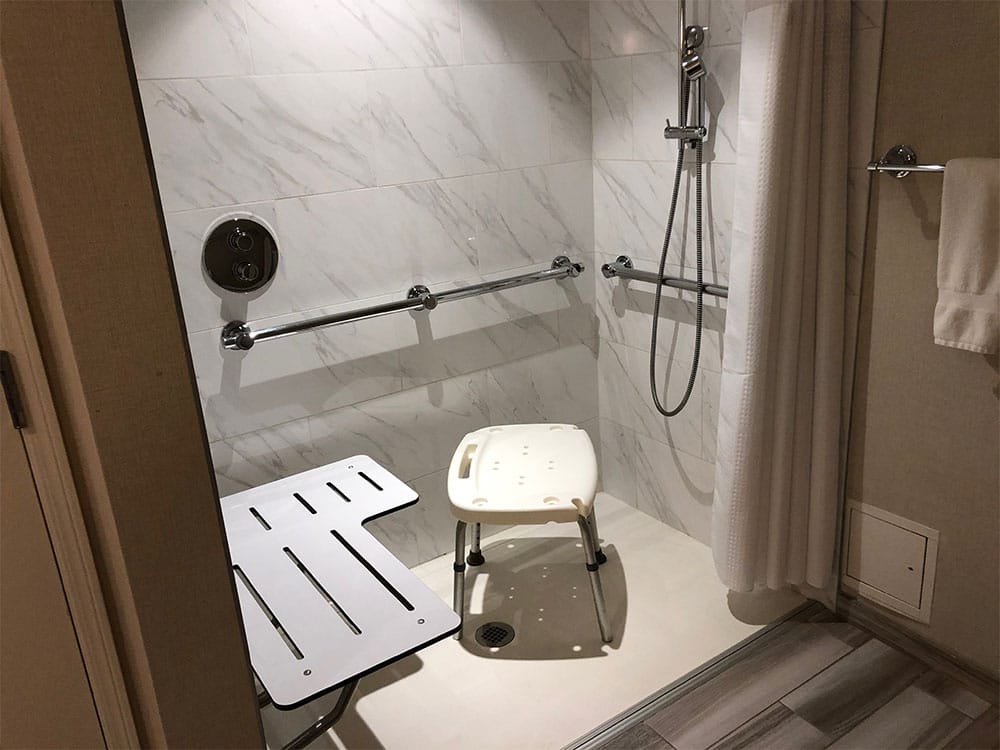 The roll-in shower is not ADA compliant, but may still be accessible.