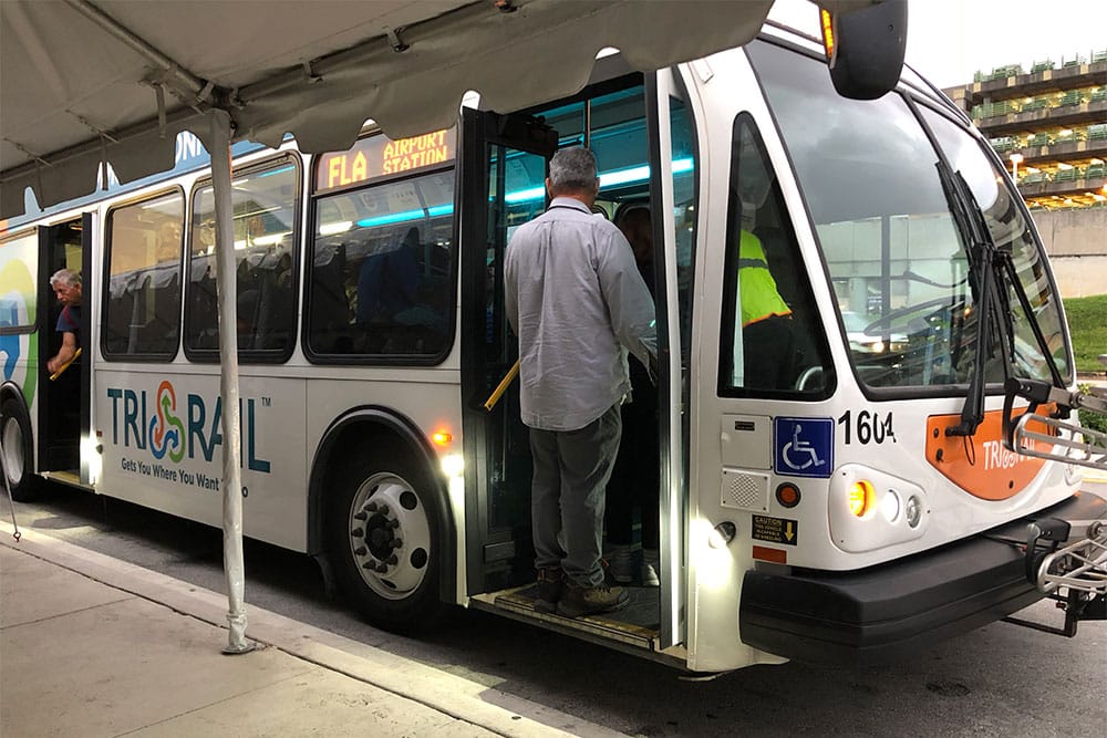 A city bus in Ft. Lauderdale, FL, fully loaded with passengers.