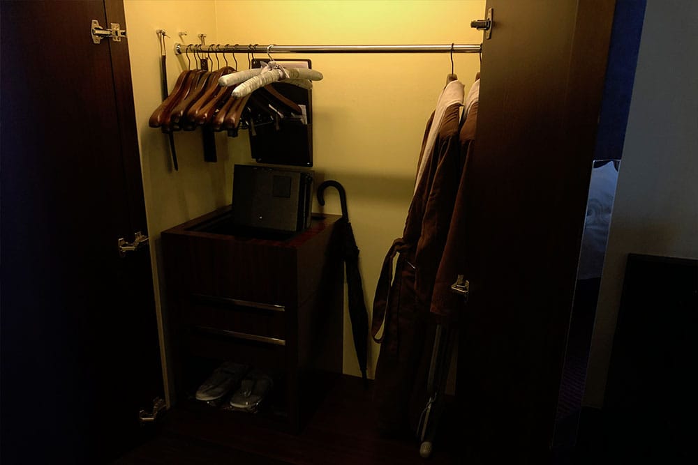 Accessible closet with a safe and lowered hanging rod.