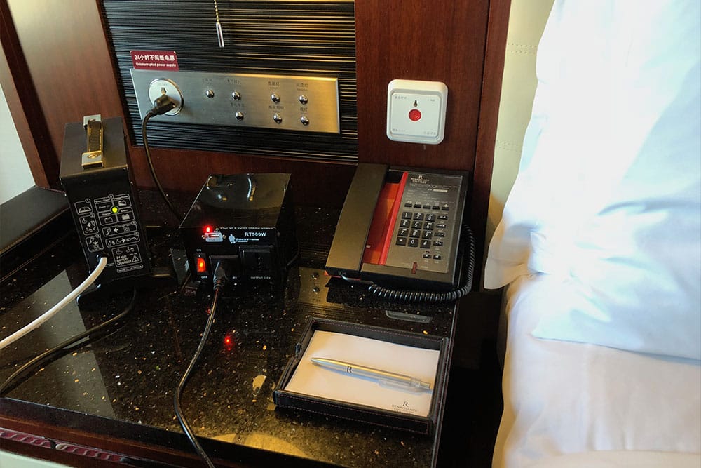 Power outlet and lighting controls within reach of the bed.