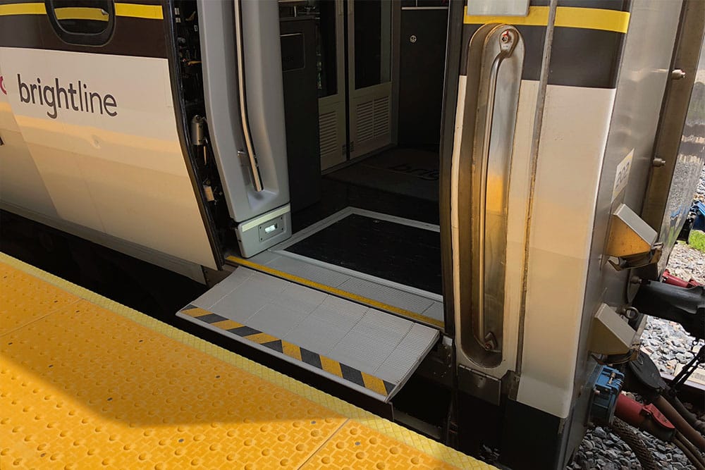 Barrier-free boarding ramp on Brightline train.