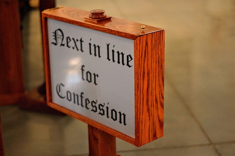 Sign in church that reads: Next in line for confession.